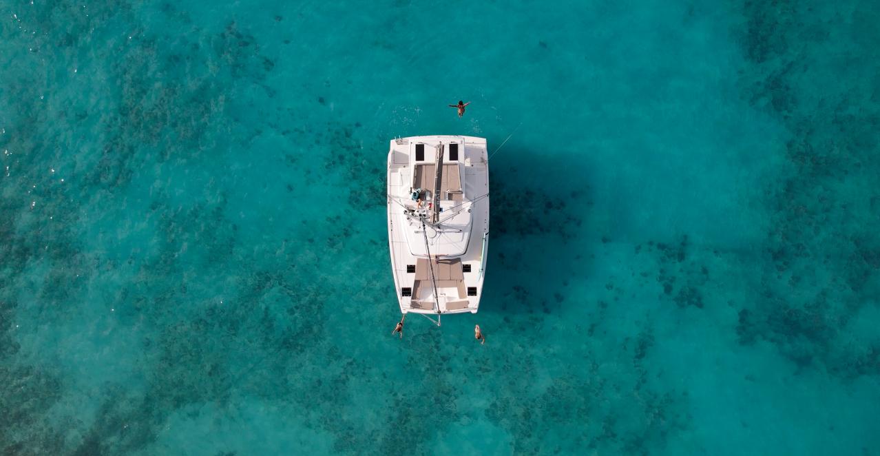 Aerial view of the Bali Cat catamaran anchored in turquoise Caicos waters